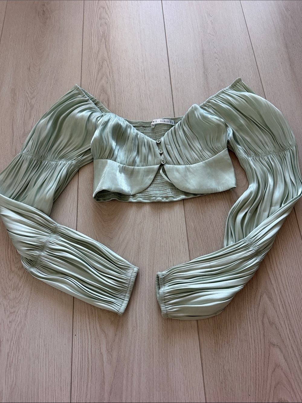 Saints + Secrets Sage Green Pleated Off-Shoulder Crop Top